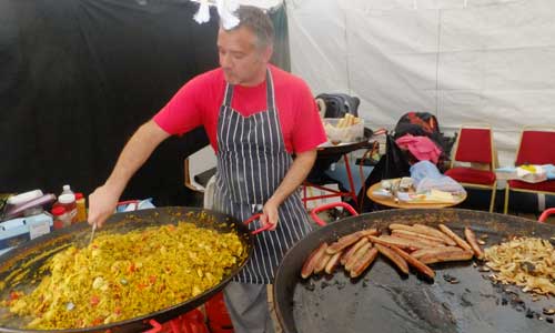 Chef and big  paella pan